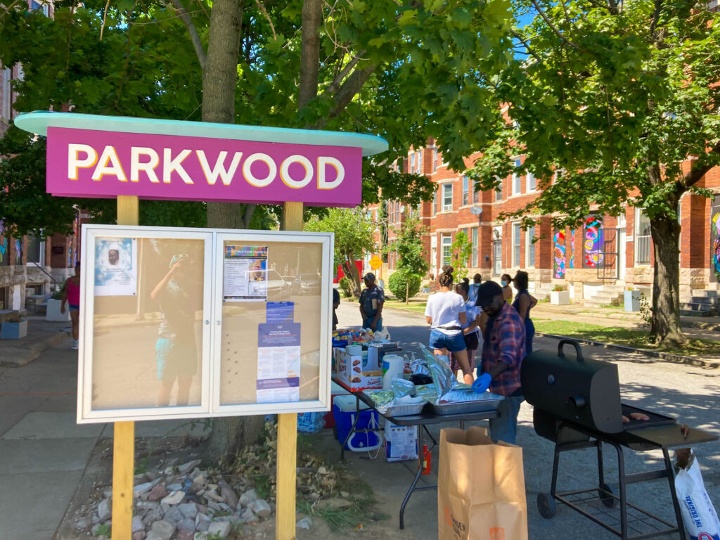 Parkwood Placemaking Celebration sign with grilling